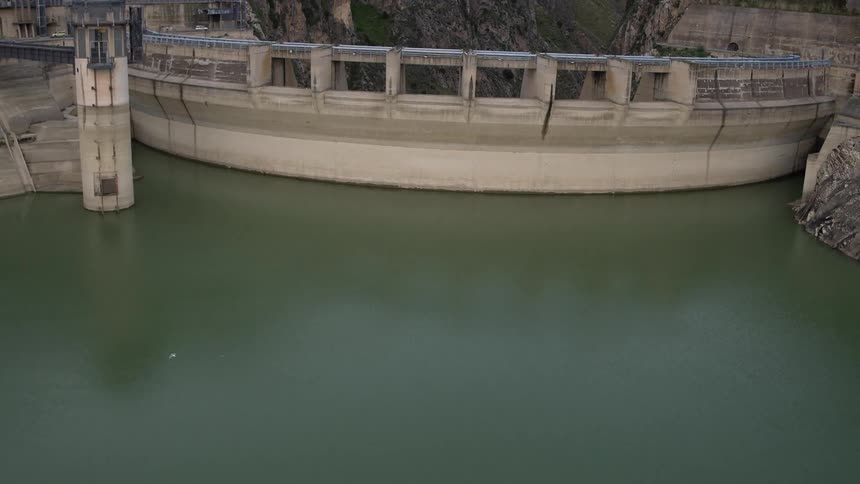 A bridge lines the side of a cliff