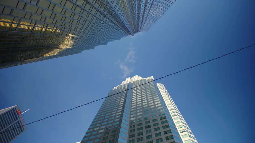 A cable line runs between tall skyscrapers