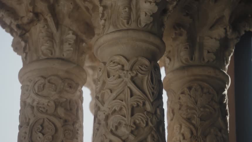 The ornately carved columns of a structure