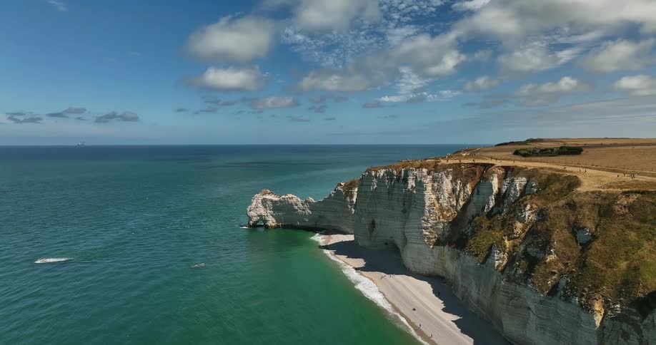 Aerial view of white cliffs on a beach next to the ocean