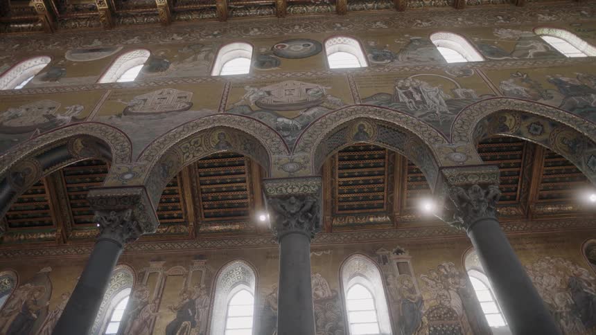 The interior arches and windows of an old cathedral during the day