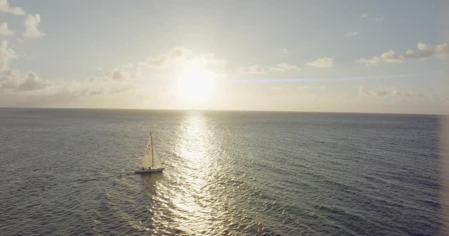 A small boat sails through open waters
