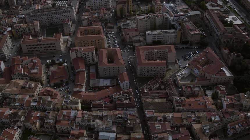 A large city area with many buildings, streets and traffic