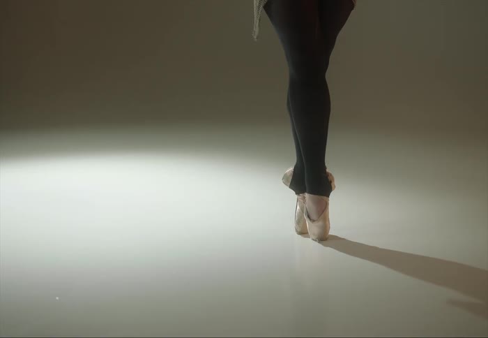 A woman is ballerina dancing