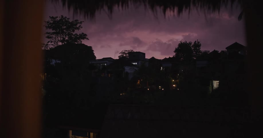 The village is dark with heavy clouds above