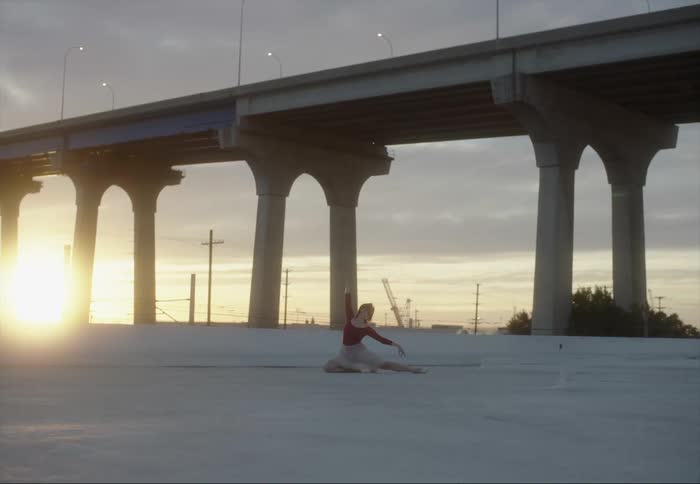 A woman dancing outdoors