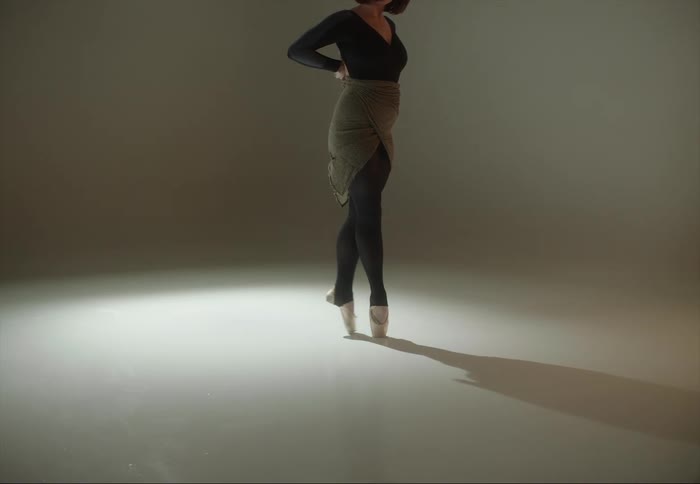 Legs of a ballerina on the tip of her toes on a studio