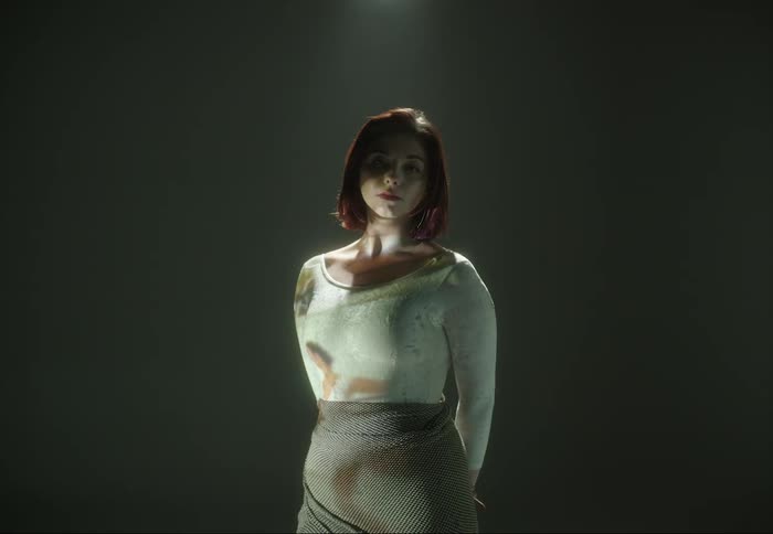 The projector is displaying film on the woman