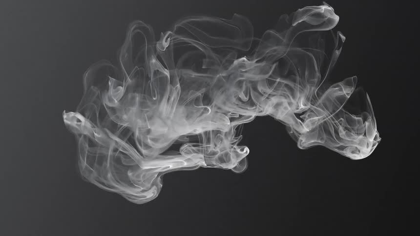 Wisps of a white smoke substance float and spread in the darkness