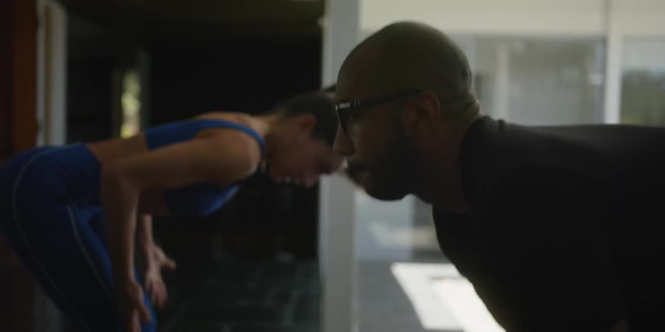 A man and woman exercise together