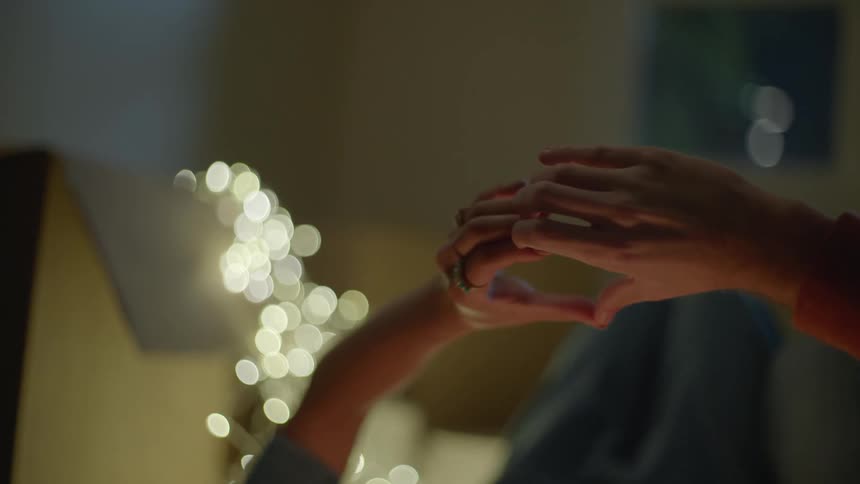 Two people touch hands together