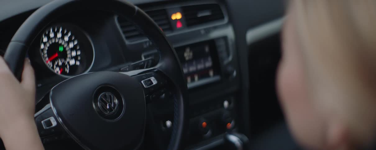 A woman is driving a car