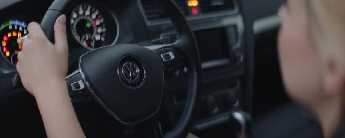 A woman is driving the car
