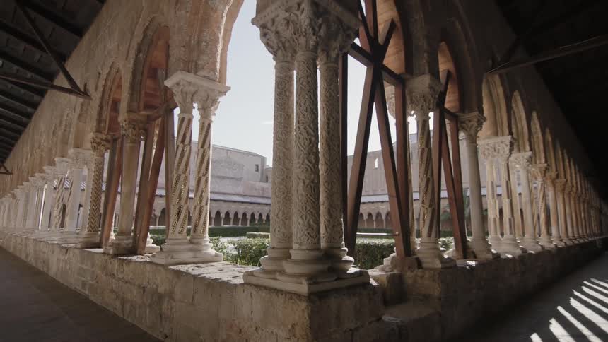 Sunlight shining through stone pillars