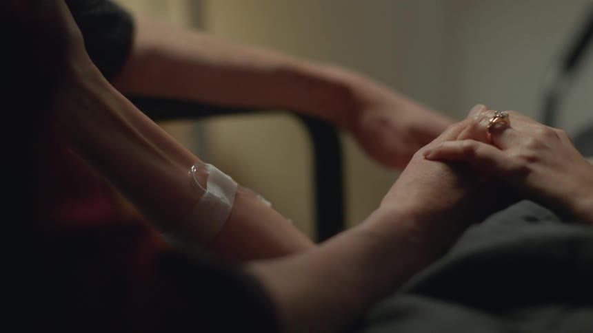 A person consoles a patient in the hospital