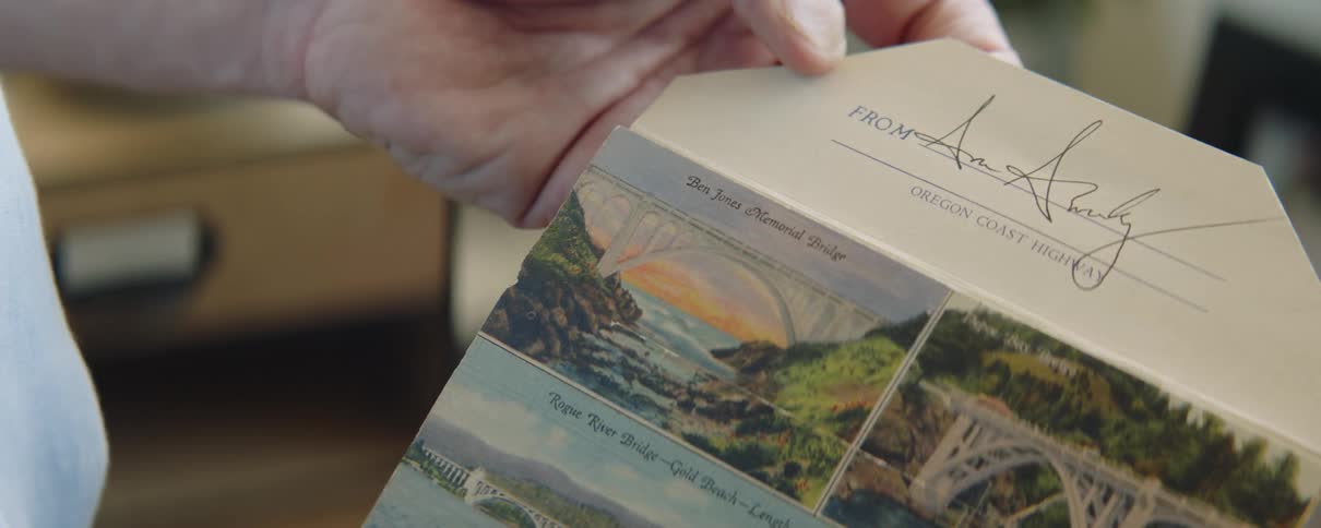 Person opens brochure that includes scenic pictures