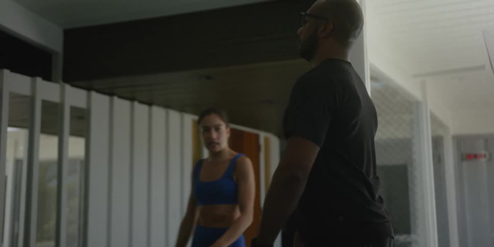 Man and woman are working out together indoors