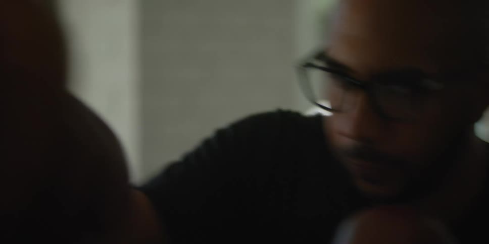 Man wearing boxing gloves bobs and weaves while punching