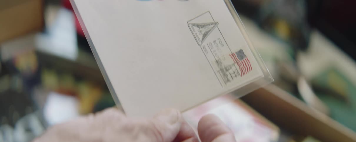 Man examines nasa related memorabilia kept in keepsake box