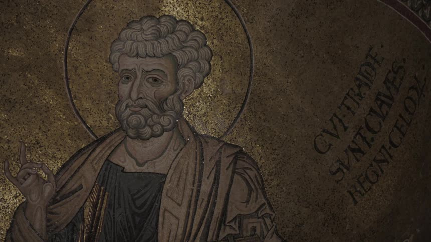 An ornate old painting of a saint on an interior alcove