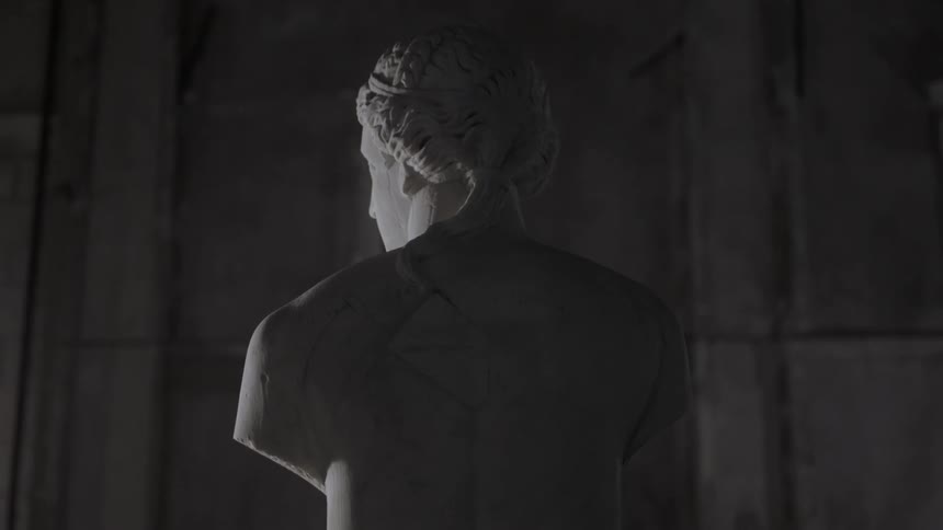 Top part of an armless sculpture in an ancient building