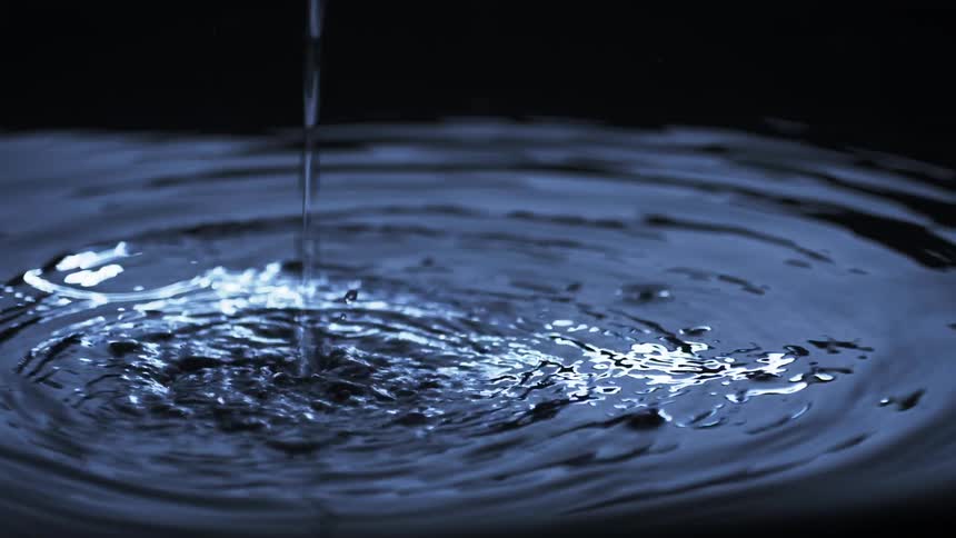 A view of water flowing into a body of water