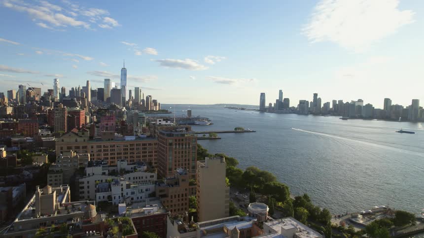 Aerial view of a downtown city near the coast is displayed