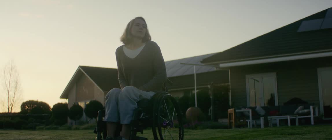 A woman in a wheelchair outdoors