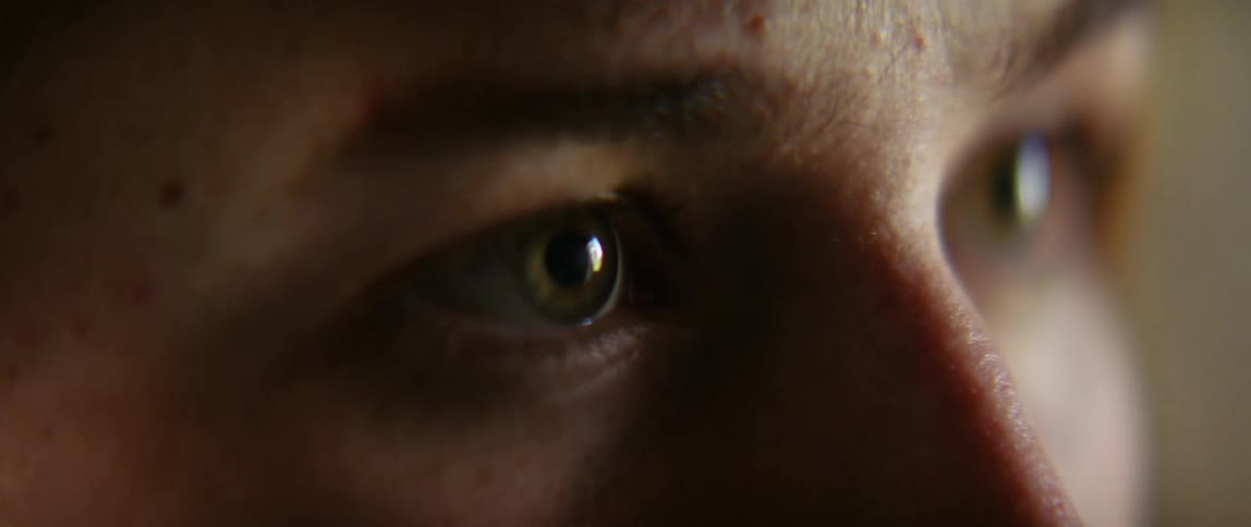 Close up of the hazelnut eyes of a blonde woman