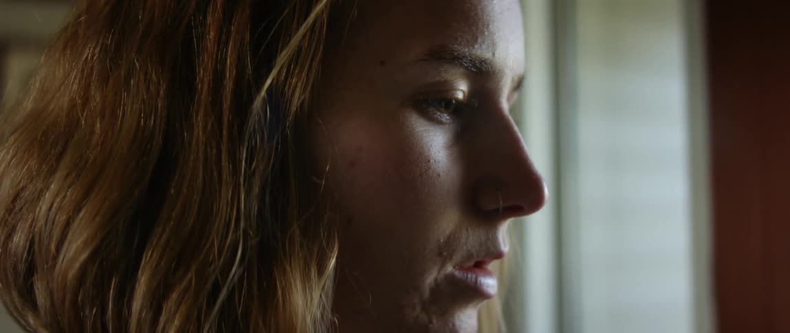 Close up view of a womans face is displayed