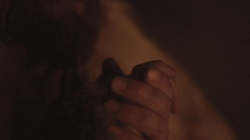 A man rubbing his hands together