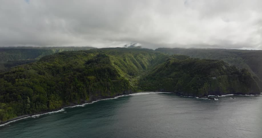 Aerial view of an island in the ocean is displayed