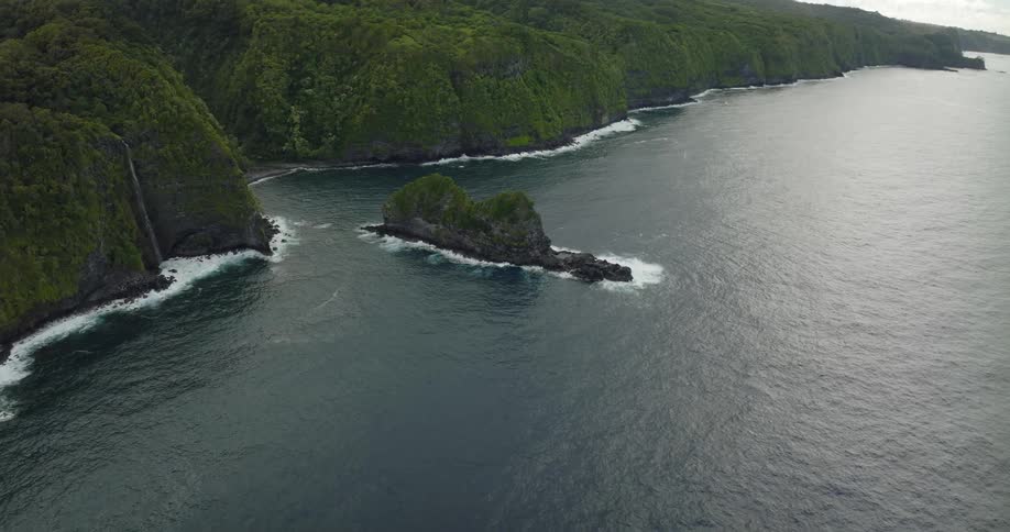 Aerial view of an island in the ocean is displayed