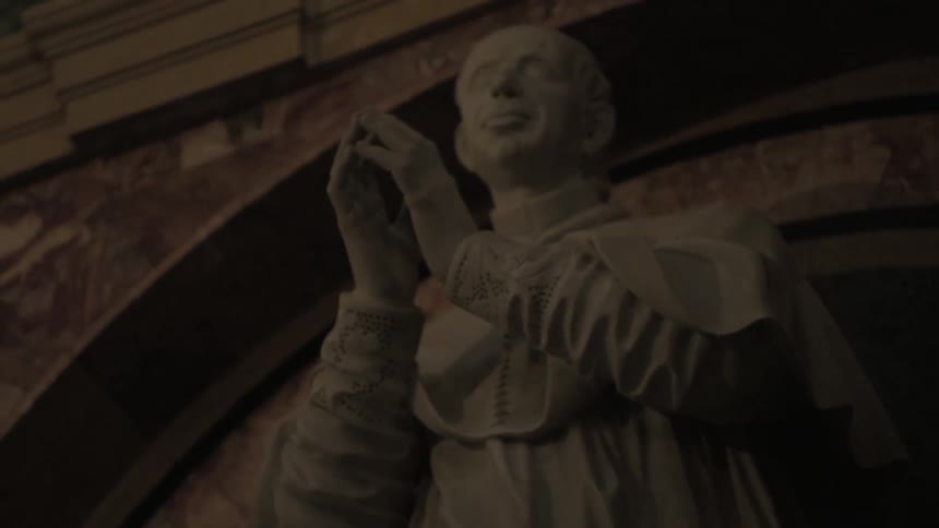 A statue of a praying monk