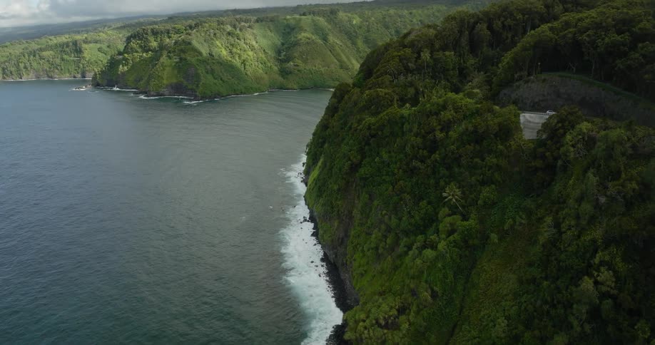 Aerial view of an island and ocean is displayed
