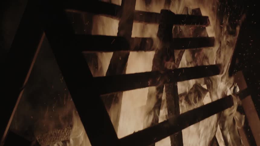 A pile of wood burns
