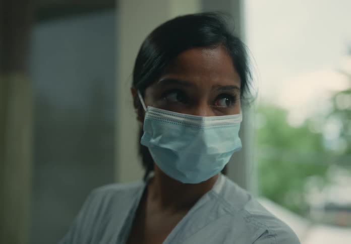 Young female healthcare worker wearing a face mask