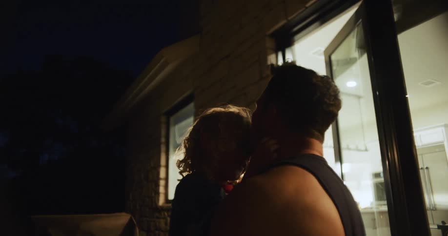 A father and daughter are playing around in there house around the daytime