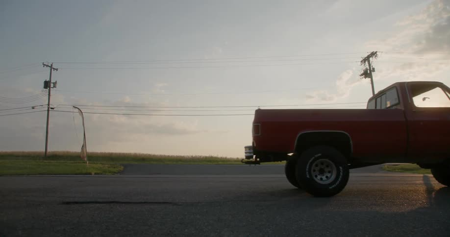 A truck starting up and driving off