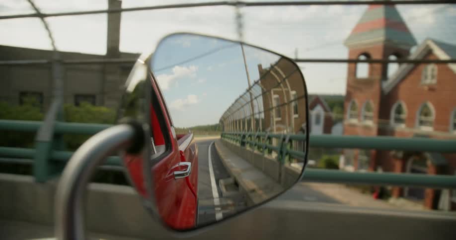 Close up view of a car driving through a city
