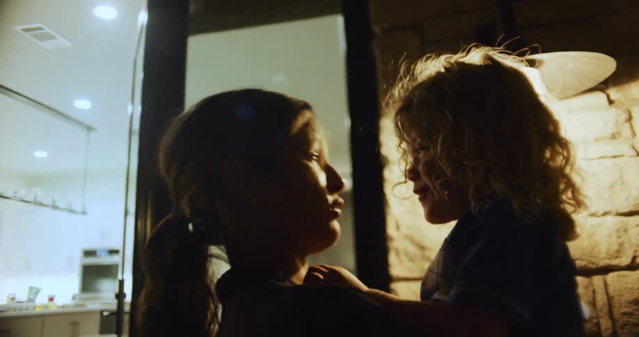A mother and daughter are talking and laughing with each other