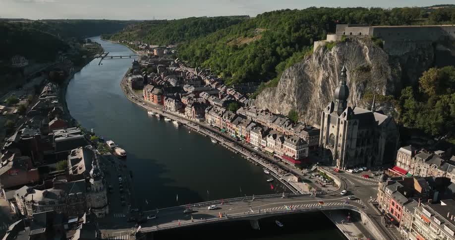 Aerial orbiting view of the citadel and church in the city of dinant on belgium