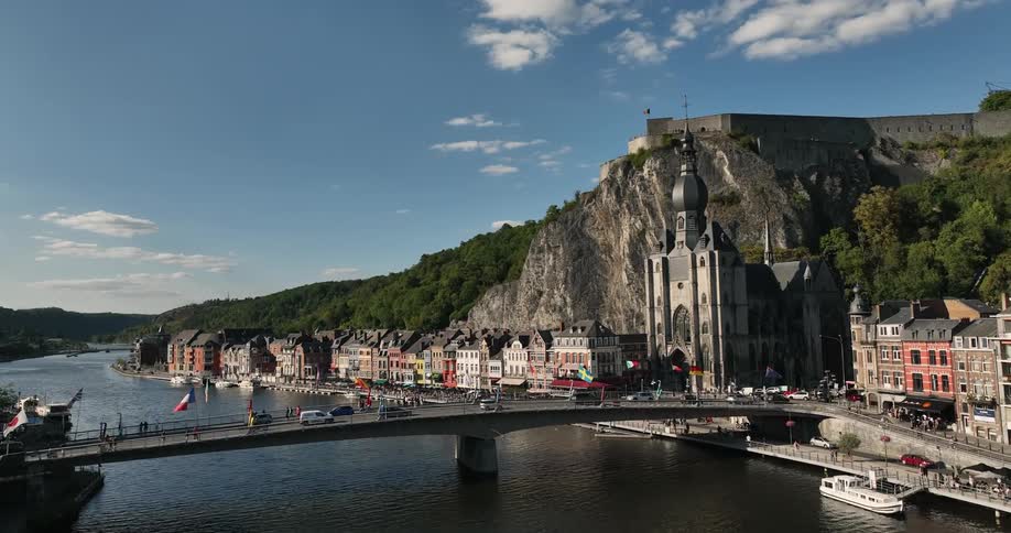 Aerial view of the traffic over the bridge near the citadel and church in the city of dinant on belgium
