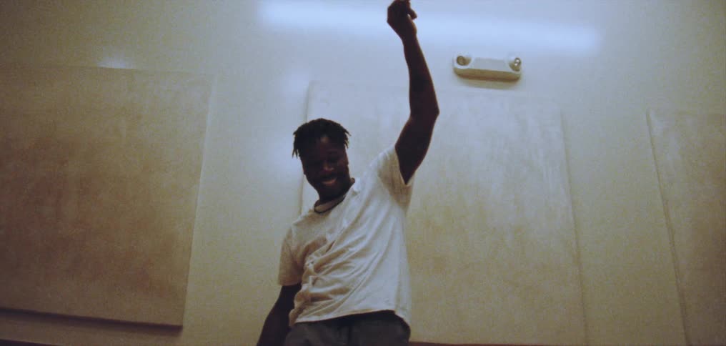 A man dances freestyle in a dance studio