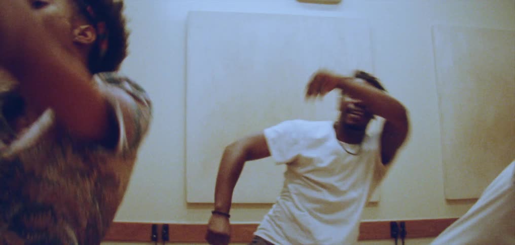A group of people all dance in a dance studio
