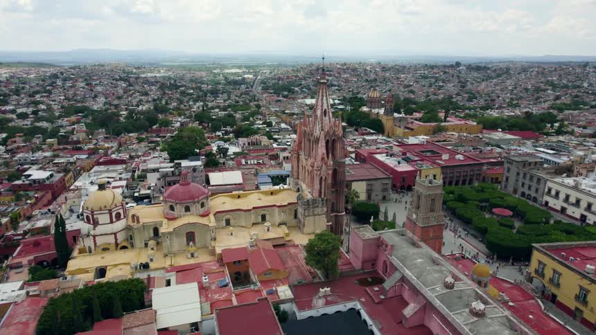 Aerial view of the colorful buildings surrounding a church on the downtown of a small latin american town