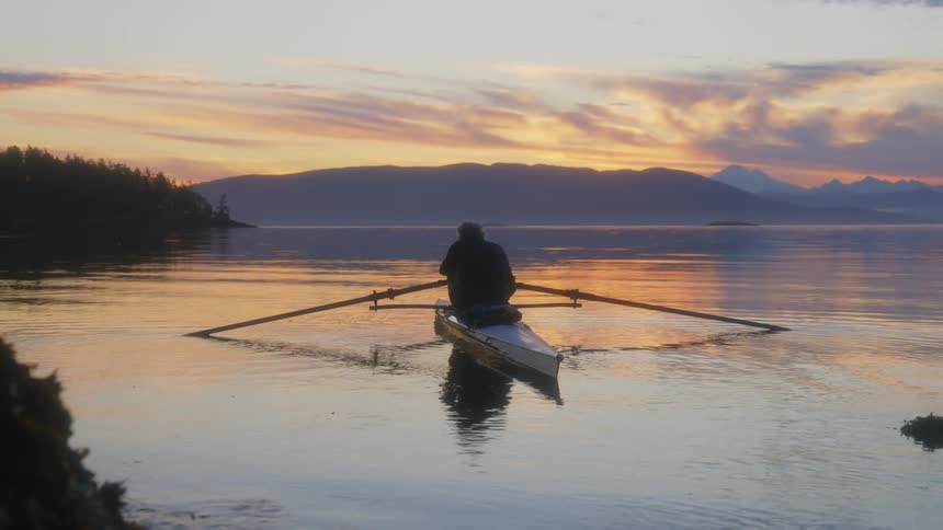 A man is in his kayak in the water