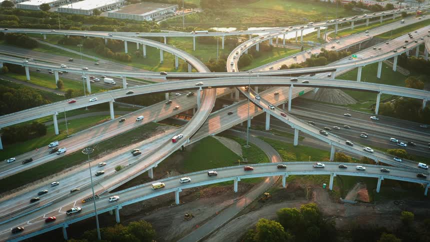 Aerial view of major road junction with traffic
