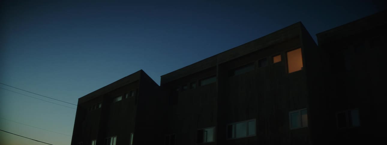 The outside of an apartment building at night