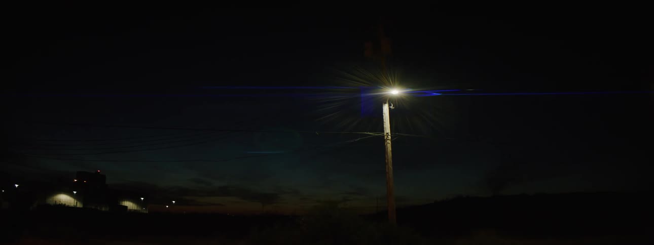 A flare on a post outdoors at night